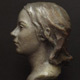 Realistic bronze portrait bust of young girl by Richard Becker. Bronze on Granite