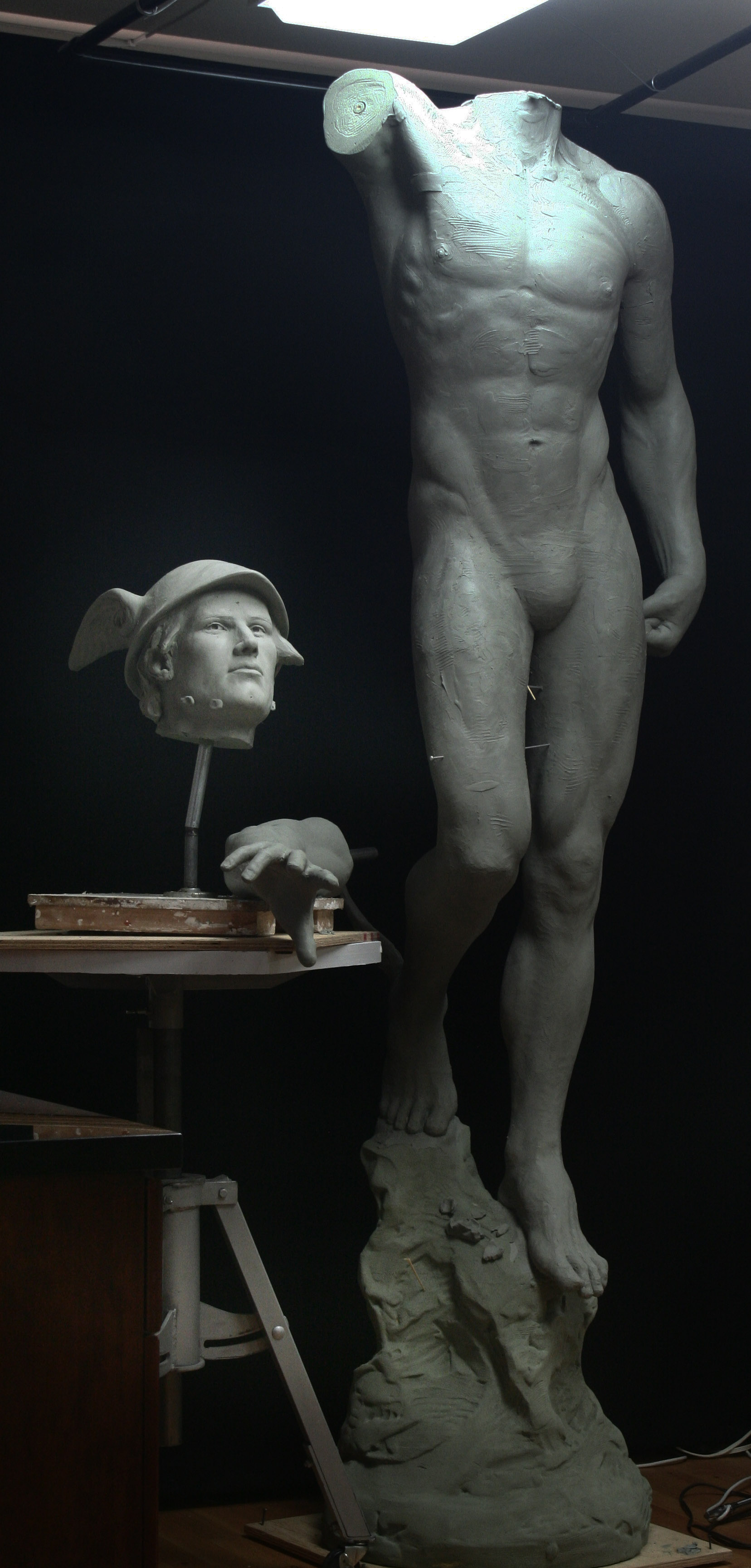 Heroic Mercury sculpture in progress with head and arms separated at studio of Richard Becker
