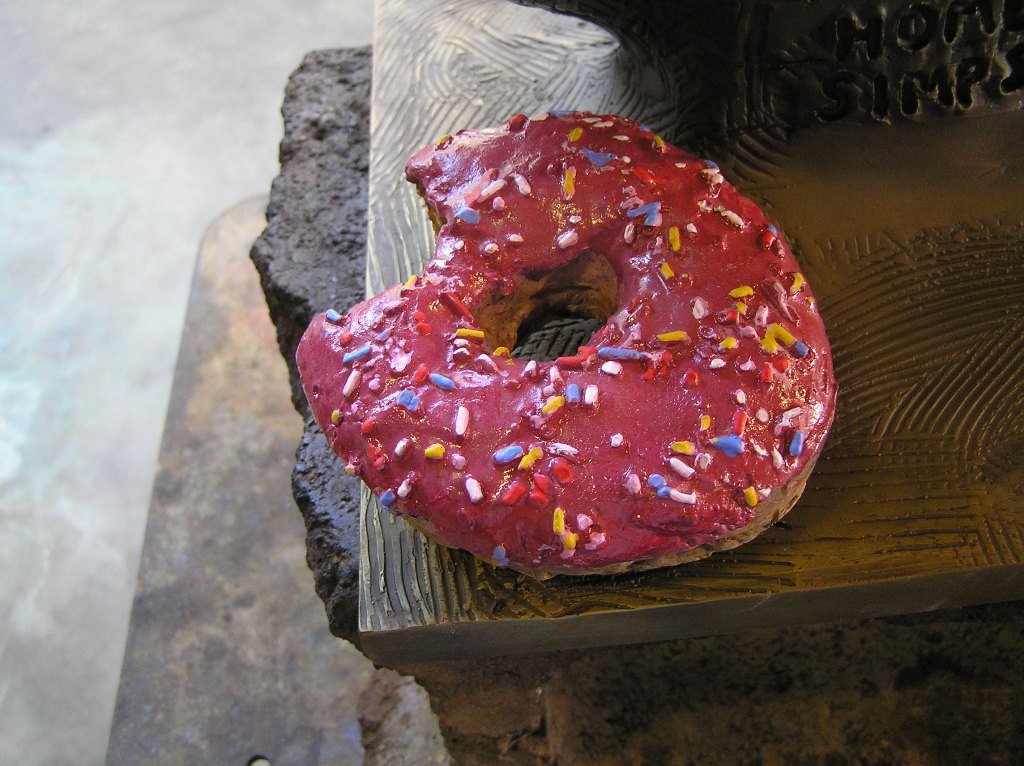 Detial of Bronze cast of the donut Richard had Matt Groening bite for the Homer SImpson bust at Fox in Los Angeles. 