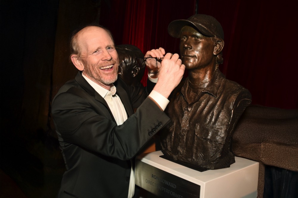 Ron Howard interacting with his bronze portrait sculpture at the Television Academy Hall of Fame installation.